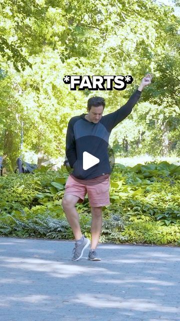 a man is running on the street with his arms in the air and words that read farts