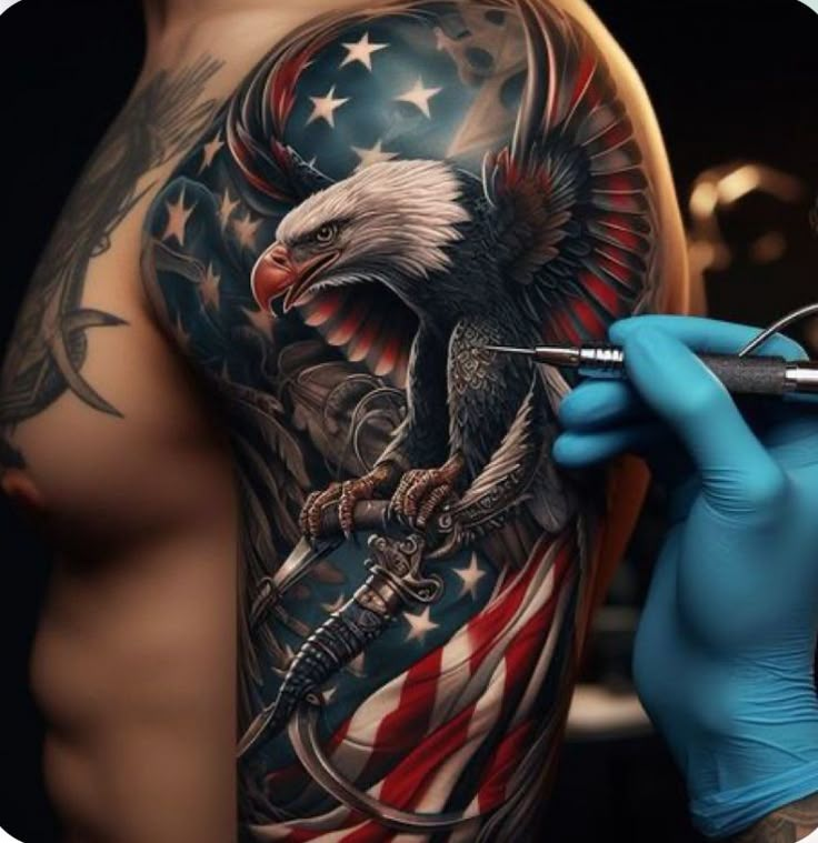 an american eagle tattoo being done on the arm by a man with blue gloves and tattoos