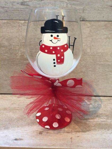 a wine glass with a snowman on it