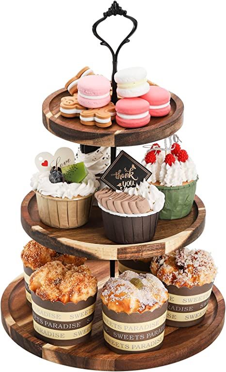 three tiered tray with different types of pastries on it