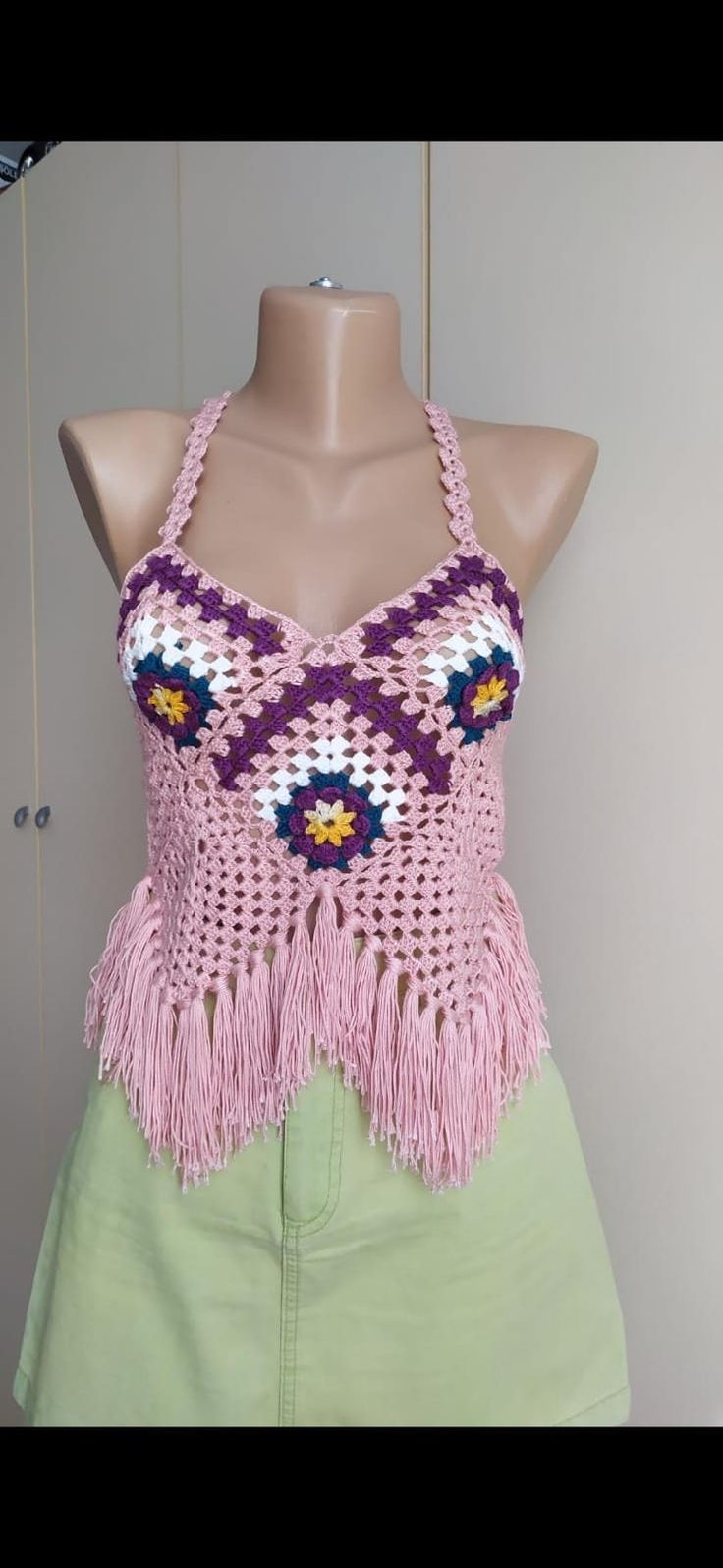 Get ready for summer festivals with our handcrafted crochet granny square halter top. Made from vegan-friendly materials, this boho top is perfect for any free spirit. *🌸 Handcrafted with love and care *🧶 Vegan-friendly, cruelty-free materials *🎨 Unique granny square design *👗 Perfect for summer festivals and beach outings *🎁 Great as a birthday gift for friends and loved ones *🌿 Comfortable, breathable, and stylish *✨ Easy to pair with jeans, skirts, or shorts for a boho chic look Bohemian Crochet Halter Neck Top For Festivals, Summer Hippie Crochet Top With Granny Square, Handmade Summer Crochet Halter Neck Top, Summer Handmade Crochet Top, Hippie Granny Square Crochet Top For Summer, Handmade Yarn Crochet Top For Summer, Handmade Halter Neck Crochet Top For Summer, Bohemian Multicolor Summer Patterns, Festival Crochet Halter Neck Top