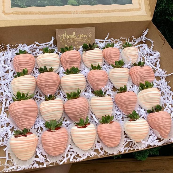 a box filled with lots of chocolate covered strawberries