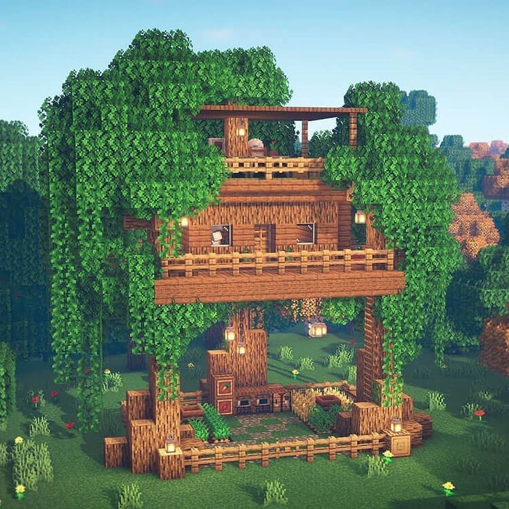 an image of a tree house in the middle of some trees and bushes on top of it