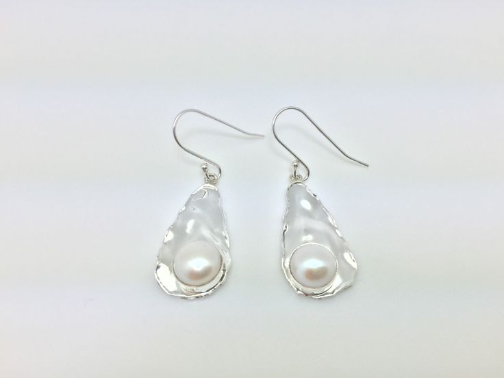 Hi everyone, just wanted to let you know we are open and shipping daily. Beautifully crafted handmade pearl and sterling silver dangle earrings. Features perfectly matched hand picked South Sea Pearls in a stunning silver setting so unique you will not go unnoticed. This line of pearl jewelry makes excellent brides made gifts and has been a top seller in our San Francisco jewelry store for years. Silver Pear-shaped Sterling Silver Pearl Earrings, Pear Shaped Pearl Drop Earrings In Sterling Silver, Pear-shaped Pearl Drop Earrings In Sterling Silver, Sterling Silver Pear Drop Pearl Earrings, Minimalist Silver Pear-shaped Pearl Earrings, Sterling Silver Pear Shaped Pearl Earrings, Silver Pear-shaped Hypoallergenic Pearl Earrings, Pierced Teardrop Pearl Earrings In Sterling Silver, Silver Drop Earrings With Pearl Detail