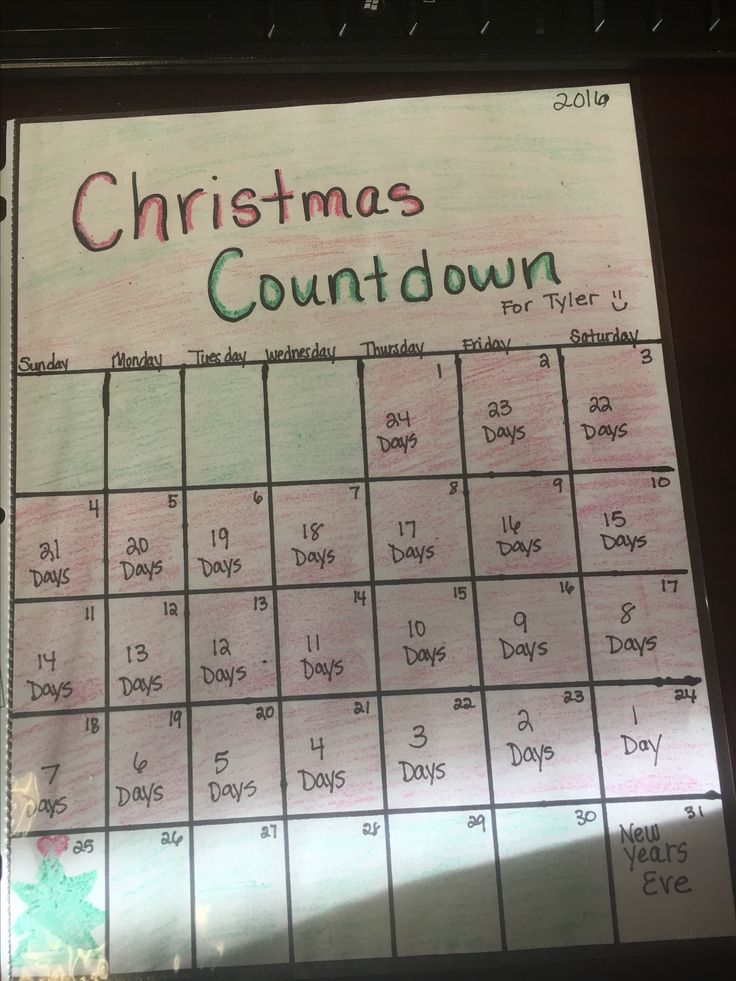 a christmas calendar on a desk with the words'christmas countdown'written in green