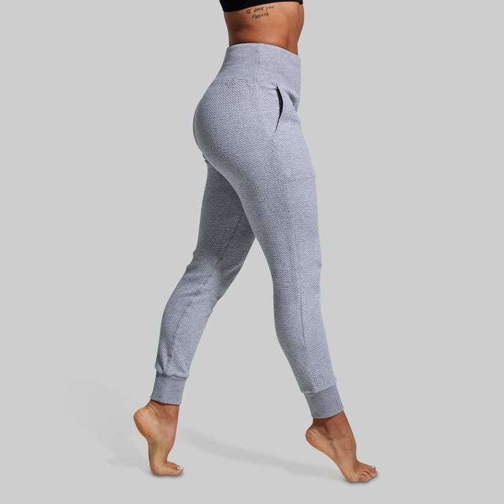 You put in the work on training day, now it’s time to recover with our women's light grey joggers. Made from a stretchy and ultra-soft textured material, slide on our Cloud Joggers for every hard-earned rest day and relax in cloud-like comfort. And don’t worry, if active rest days are more your style, these grey sweats with pockets are the perfect option for light jogs or mobility days. Gray Squat Proof Functional Bottoms, Functional Gray Squat Proof Bottoms, Gray Athleisure Bottoms For Gym, Gray Athleisure Gym Bottoms, Gray Athletic Fit Bottoms For Yoga, Sporty Gray Yoga Pants For Workout, Gray Sweatpants With Elastic Waistband For Gym, Gray Athleisure Bottoms With Ribbed Waistband, Gray Stretch Activewear For Jogging