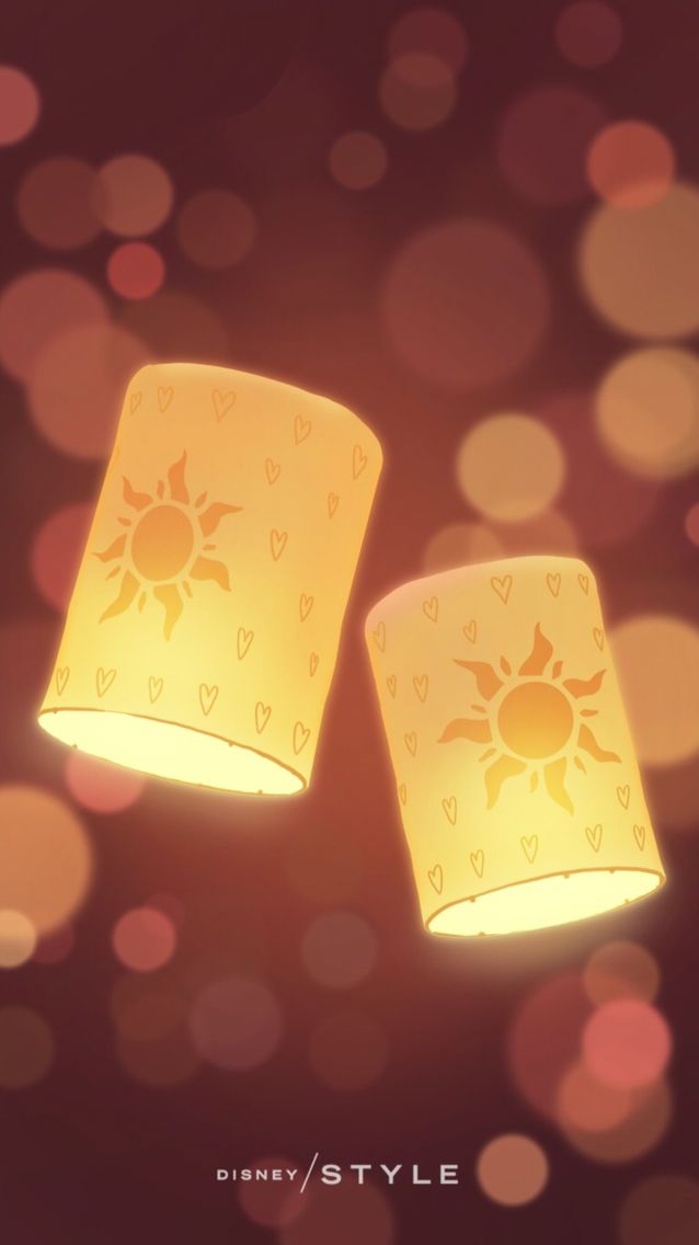 two yellow lamps with hearts and sun designs on them