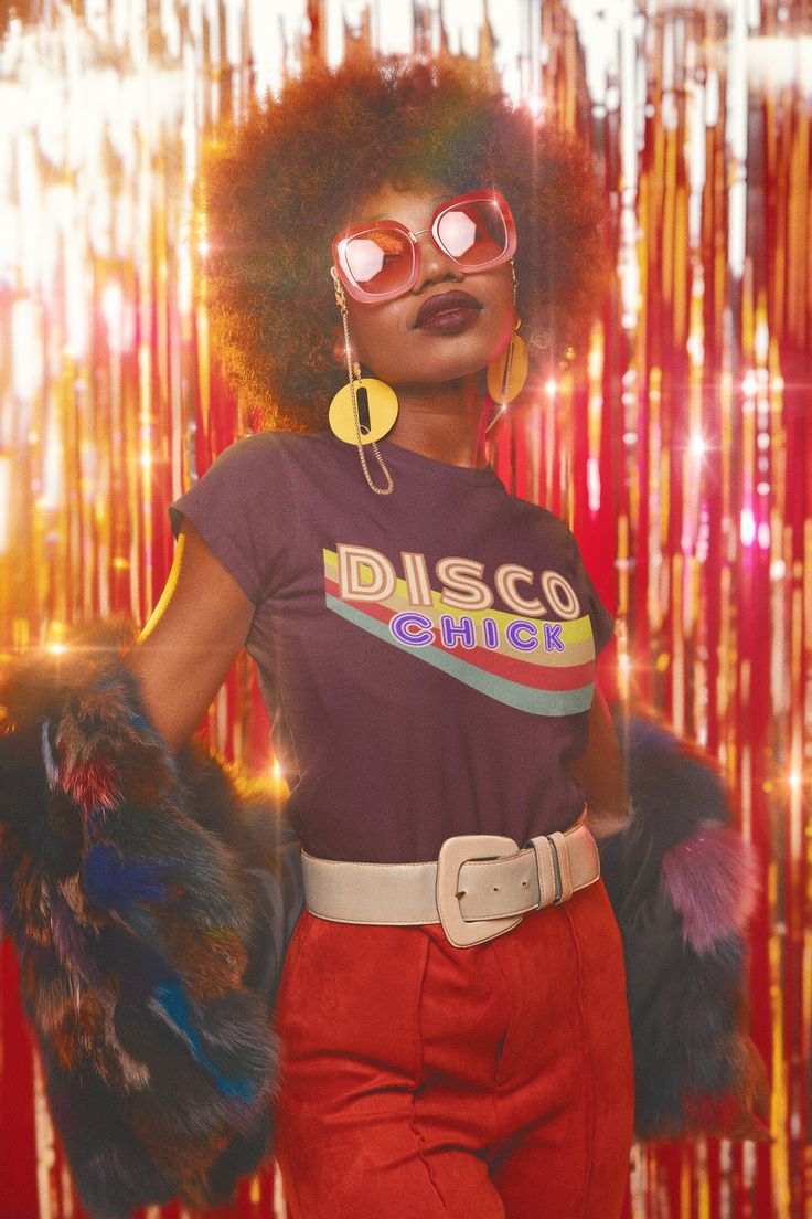 "Wear the \"Disco Chick\" shirt to make a statement and let your attire reflect your unique blend of passion for retro music and the enduring spirit of disco. Celebrate the disco fever, the unity of dancers, and the timeless groove of this era while showcasing your chic style. This classic unisex jersey short sleeve tee fits like a well-loved favorite. Soft cotton and quality print make users fall in love with it over and over again. These t-shirts have-ribbed knit collars to bolster shaping. The shoulders have taping for better fit over time. Dual side seams hold the garment's shape for longer. .: 100% Airlume combed and ringspun cotton (fiber content may vary for different colors) .: Light fabric (4.2 oz/yd² (142 g/m .: Retail fit .: Tear away label .: Runs true to size Disco T-Shirt, Re Vintage Fitted T-shirt With Funny Print, Groovy Short Sleeve T-shirt With Funny Print, Retro Crew Neck T-shirt For Music Festival, Retro Short Sleeve Tops With Graphic Design, Retro Fitted Graphic Print T-shirt, Retro Crew Neck Top With Graphic Design, Retro Cropped T-shirt With Letter Print, 90s Retro Print Cotton T-shirt, Groovy Graphic Print Short Sleeve T-shirt