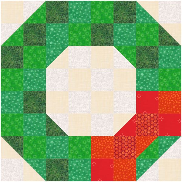 a green, red and white quilt with an octagonal design on the center is shown