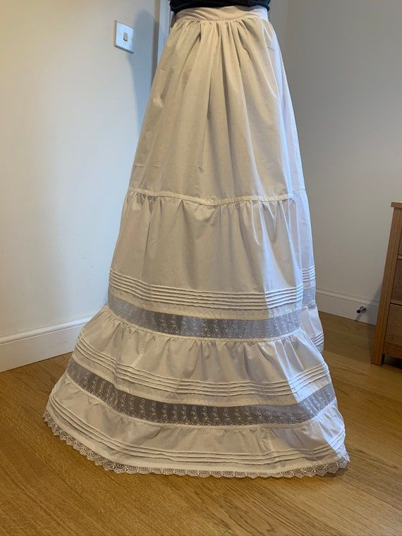 Victorian/edwardian Style Flounced Petticoat/underskirt Maxi - Etsy Full Skirt With Ruffles In Crinoline, Full Crinoline Skirt With Ruffles, White Regency Style Petticoat With Ruffles, Lace Maxi Skirt With Ruffles And Tiered Design, Tiered Ruffled Crinoline Petticoat, Crinoline Tiered Petticoat With Ruffled Skirt, Lace Tiered Maxi Skirt With Ruffles, Crinoline Tiered Ruffled Petticoat, Lace Full Skirt Dress With Lined Skirt