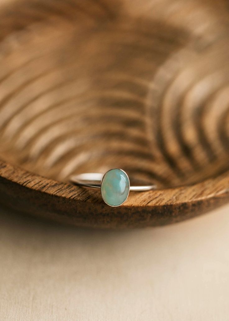 Our Alyce Ring, inspired by aurora borealis, is made with the alluring chalcedony gemstone. Chalcedony is connected to the throat chakra and is believed to be the stone of communication. Assisting in the dissipation of negative energy, chalcedony is the perfect gemstone to align with the mind, body, and spirit. 6x8mm Oval Chalcedony Stone. Shown on Maddie with our Flora Ring + Reputation Ring. Shown on Kimmie with our Maui Chain Ring + Cleo Ring. Available in 14kt Gold Fill + Sterling Silver. Ha Reputation Ring, Turquoise Ring Engagement, Copper Uses, Everyday Wear Jewelry, Easy Zucchini, Chalcedony Stone, Sparkly Things, Mind Body And Spirit, Zucchini Recipes