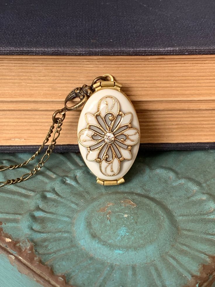 For yourself or someone you love... Timeless and classic, this gorgeous Antique brass filigree locket will become a special addition to your jewelry collection. The locket opens to the side to reveal 4 places, Glue on photos or keep a secret note locked away, close to your heart. SIZE: Oval locket: approx 32mmx20mm You can select a LENGTH you like! I also have another vintage silver locket with dragonfly here: https://www.etsy.com/listing/173498129/ Happy customers said this: AMAZING! The photo Victorian Style Nickel-free Necklace For Weddings, Victorian Nickel-free Wedding Necklace, Victorian Wedding Necklace Nickel-free, Victorian Wedding Necklace Nickel Free, Victorian Style Nickel-free Wedding Necklace, Elegant Handmade Antique Gold Locket Necklace, Nickel-free Brass Locket Necklace For Wedding, Antique Adjustable Locket Necklace, Antique Gold Victorian Jewelry Gift