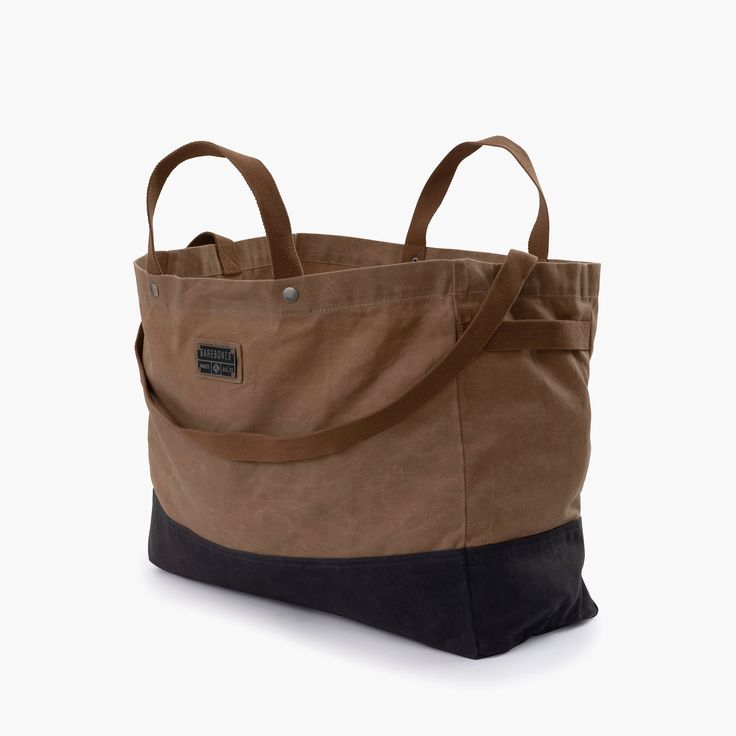 a brown and black tote bag on a white background