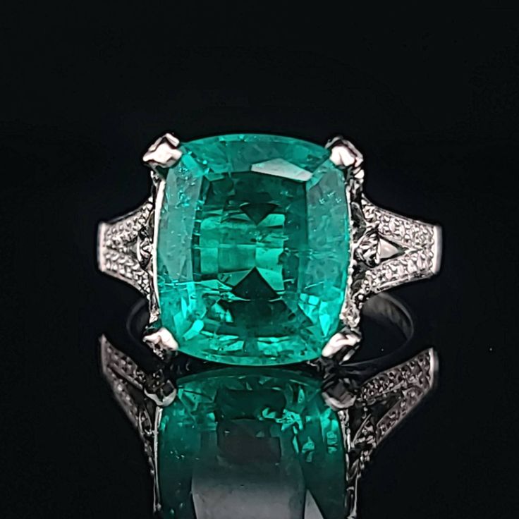 GORGEOUS 18K WHITE GOLD DIAMOND AND COLOMBIAN EMERALD RING IN CUSHION SHAPE CENTER 5.67 CARAT SIZE 12x10 CENTER EMERALD center lab treated Flux Growth EMERALD COLOMBIA BERYL EMERALD GORGEOUS COLOMBIAN EMERALD AAA RATED!! VERY CLEAN ,VERY NICE CUT ,AMAZING BRILLIANCE FULL OF FIRE, side round natural diamonds 0.50ct. SI1 quality H- COLOR size 6.5 Retail value $9,500 net . Appraisal available Luxury Gia Certified Diamond Gemstones, Luxury Gia Certified Platinum Gemstones, Luxury Gia Certified Gemstones, Luxury Gia Certified Emerald Gemstones, Luxury Brilliant Cut Platinum Gemstones, Classic Platinum Gemstones Gia Certified, Luxury White Gold Gia Certified Gemstones, Classic Gia Certified Platinum Gemstones, Gia Certified Platinum Classic Gemstones