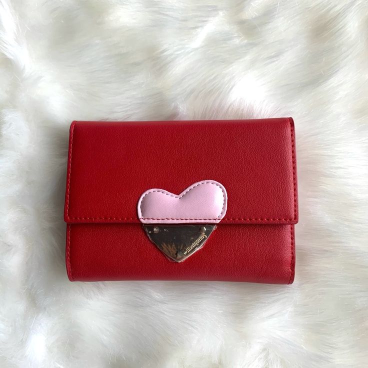 Compact Wallet With Heart On Front. Color Is Red. This Wallet Has 10 Card Slots And 2 Bill Compartments. Brand New, Never Used. Cute Red Wallets For Daily Use, Pink Heart-shaped Wallets For Gifts, Pink Heart-shaped Wallet For Gift, Heart-shaped Pink Wallet As Gift, Pink Wallets With Card Slots For Valentine's Day, Cute Red Wallets For Everyday Use, Cute Red Coin Purse For Daily Use, Rectangular Wallets For Daily Use On Valentine's Day, Trendy Wallets For Valentine's Day Gift