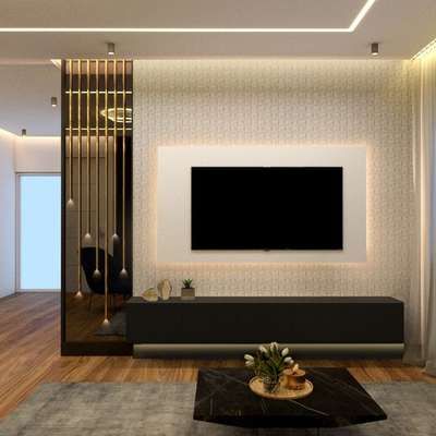 a modern living room with white walls and wood flooring, black furniture and a flat screen tv mounted on the wall