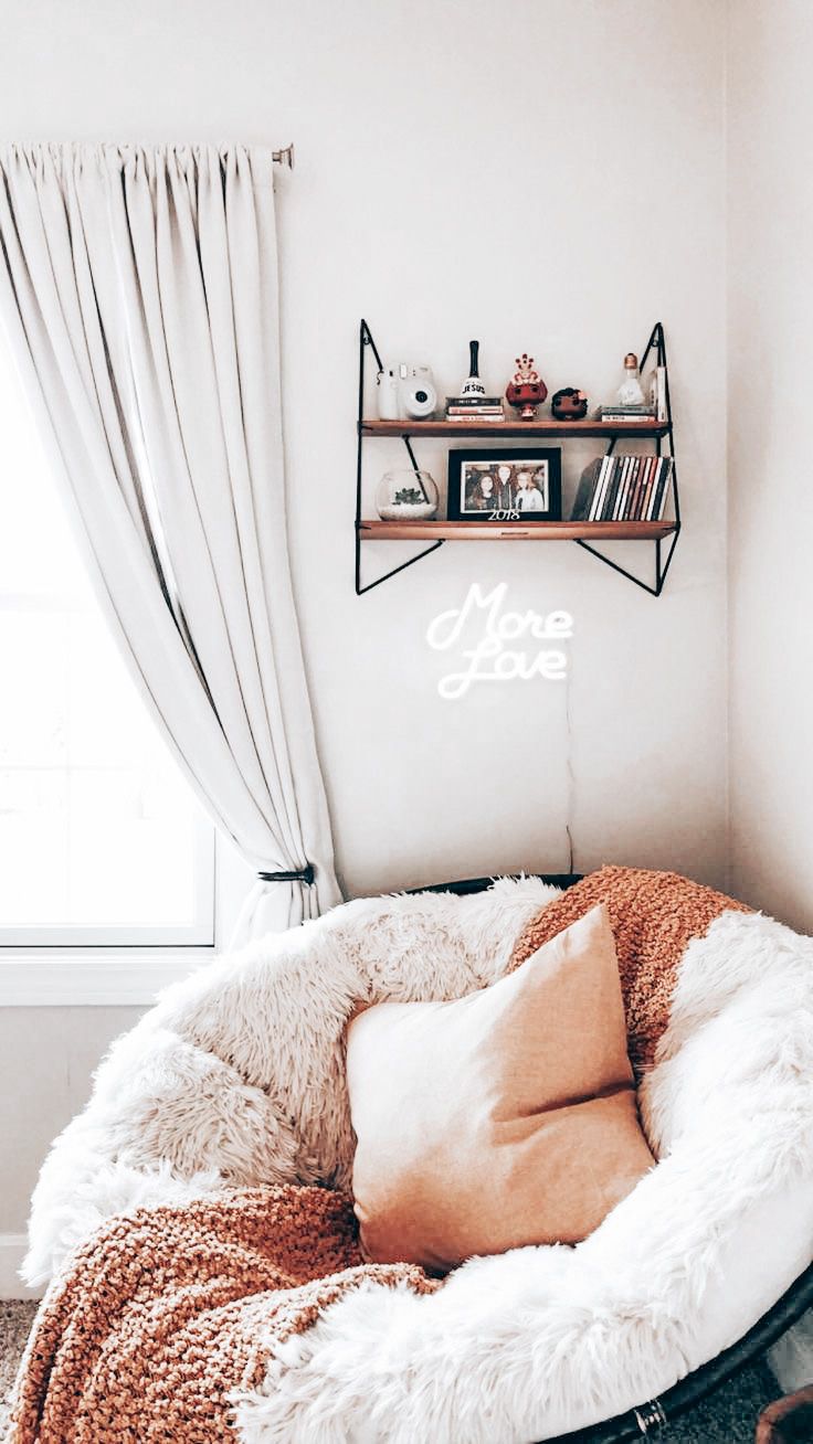 a dog bed in front of a window with the words love spelled on it's side