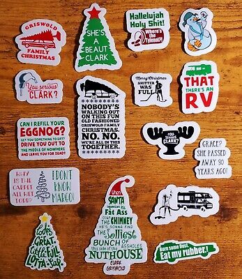 many different stickers on a wooden surface