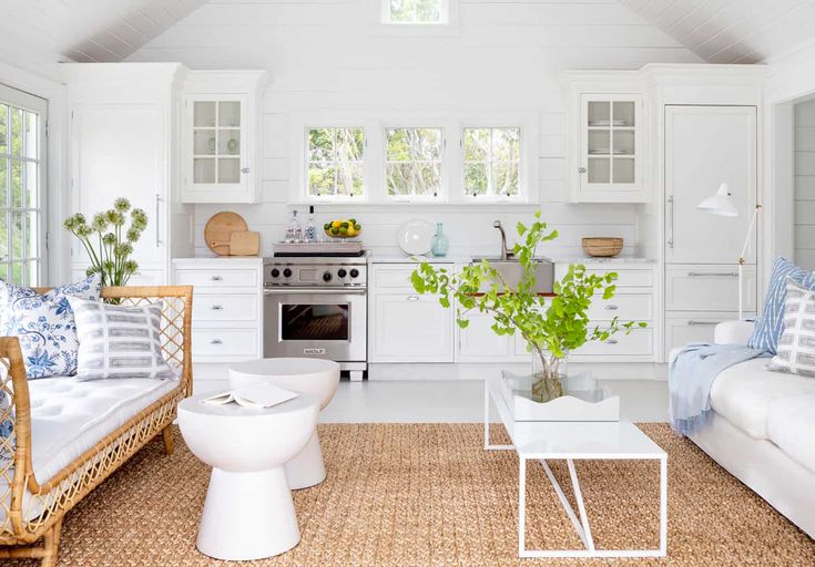 a living room filled with furniture and a stove top oven