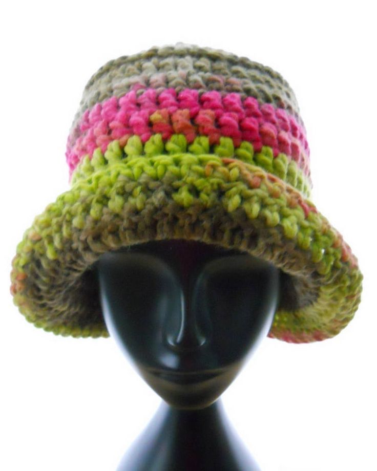 a crocheted hat is on top of a mannequin's head