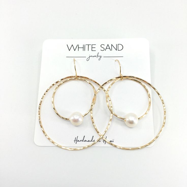 White Edison Pearl Hoop within a Hoop Earrings. PLEASE NOTE: The Edison pearls will vary in shape, size and color and will have natural occurring birthmarks. The pearls will range and measure from 9mm to 11mm. These are stock photos, the earrings you receive will be similar but different. NOTE: This listing is for ONE pair of earrings only. All White Sand Jewelry comes in a hand stamped gift box ready for gifting. PROCESSING TIME: Each piece is handcrafted and made-to-order, specifically for you White Hoop Jewelry For Anniversary, Everyday White Hoop Pearl Earrings, Minimalist White Hoop Pearl Earrings, Minimalist White Pearl Hoop Earrings, Modern White Hoop Jewelry, Nickel-free White Hoop Pearl Earrings, White Small Hoop Pearl Earrings With Ear Wire, Modern White Pearl Hoop Earrings, White Pearl Small Hoop Earrings With Ear Wire