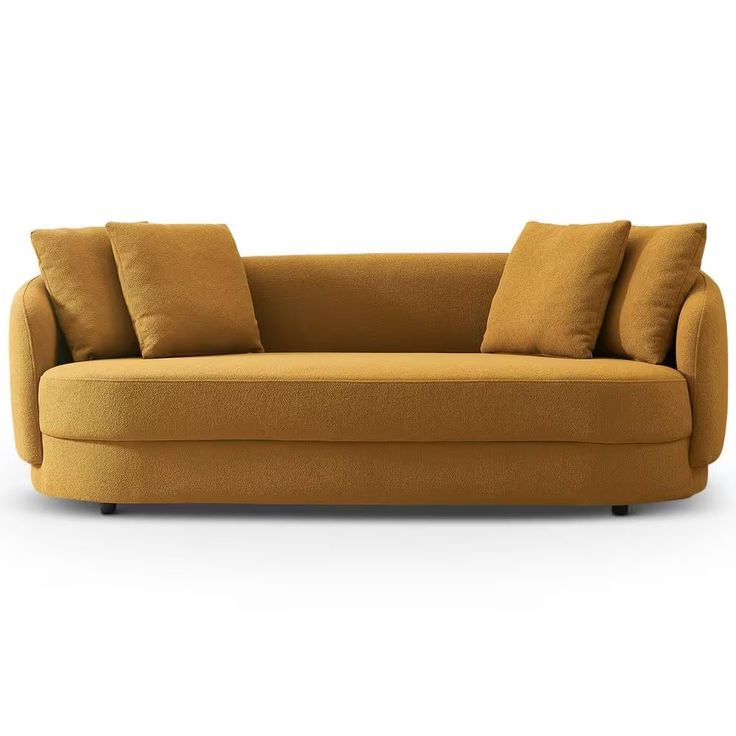 a yellow couch with pillows on it