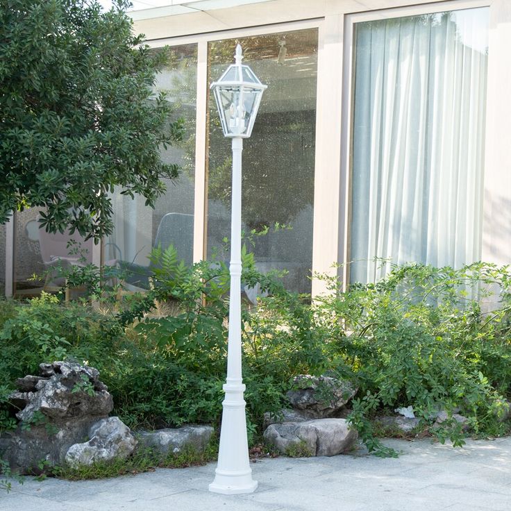 Metal construction with glass lampshade. Easy installation with all mounting hardware included. Constructed from weather resistant aluminum with clear glass heads; Requires (3) 100W medium base bulbs (Not included). Reminiscent of a vintage-style street lamp. Hardwired design is perfect for your driveway, garden, pool area and walk ways. LUTEC 88.58-in H White Hardwired Incandescent Post Light | 7251211053 Driveway Garden, Glass Lampshade, Street Lamp, White Lamp, Garden Pool, Post Lights, Pool Area, Metal Construction, Driveway