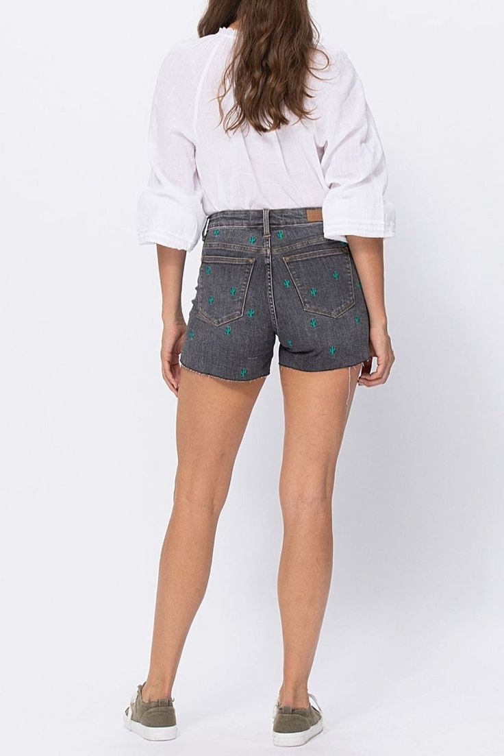 The Cactus Embroidery Cut Off Shorts by Judy Blue are everything you wished for! High-waisted, comfy with good stretch, cute embroidered cacti, and the Judy Blue quality you're used to! Rise: 10.75"Inseam: 3.75" Material: 91% Cotton, 7% Polyester, 2% Spandex Sizing Tip: We recommend sizing down one from your normal non-Judy Blue jean size. Sarah is shown wearing a size Large. Model Info:Size: SmallHeight: 5'10"Waist: 25"Hip: 36" Embroidery Shorts, Embroidered Cactus, Cactus Embroidery, Grace And Lace, Sport Bra Top, Denim Joggers, Judy Blue Jeans, Romper Dress, Good Stretches