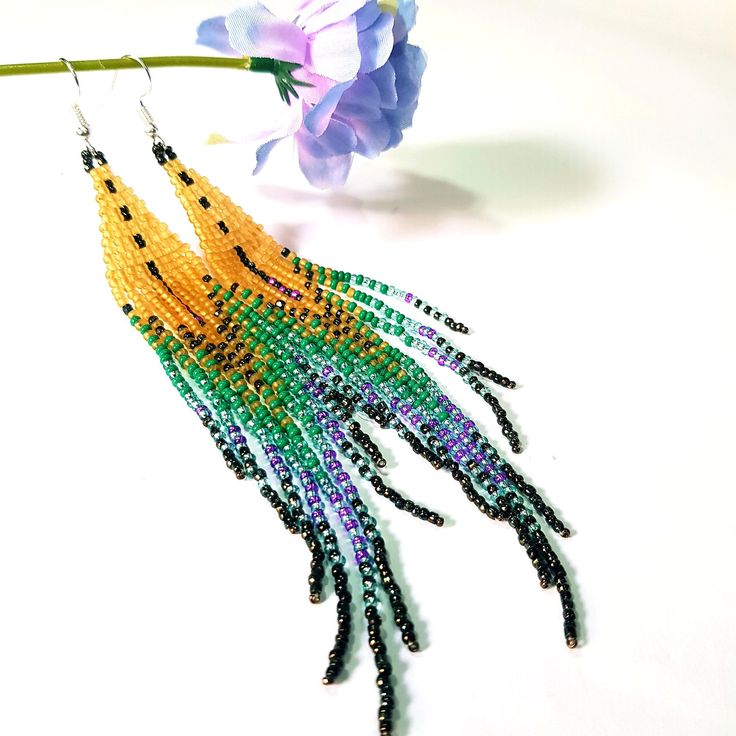 "dangle beaded earrings. with fringe are made of high quality Czech and Japanese seed beads.Very long earrings.Bead weaving techniques. Colors: Mustard Yellow matt,Purple amethyst,Green,Golden brown ! Details ! Made with quality Japanese and Czech seed beads ! Professional threads for weaving with beads Tytan and Fireline. ! Length 5 inches ( 13cm) ! Sterling silver plated ear wire. Simple sterling silver ear wire 925 are included with each earrings. ! Approximate Weight 5g Earrings. ! INSTRUCTI Purple Dangle Tassel Jewelry, Purple Dangle Jewelry With Tassels, Purple Fringe Beaded Earrings As Gift, Purple Fringe Beaded Earrings For Gift, Purple Beaded Earrings With Tassels For Gift, Yellow Fringe Dangle Jewelry, Purple Fringe Tassel Earrings Gift, Yellow Fringe Beaded Earrings With Round Beads, Yellow Beaded Earrings With Fringe