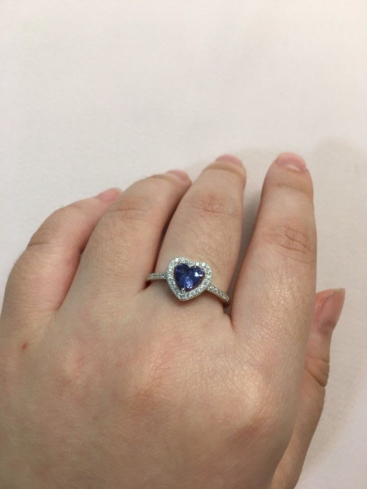 This is a 925. Genuine Sterling Silver and Cubic Zirconia Heart Tanzanite Ring We have sizes: 5, 6, 7, 8, 9 available. Return policy is within 30 days of purchase. White Gold Heart Cut Ring With Halo, Sterling Silver Rings With Halo Setting And Heart Cut, Heart Shaped Cubic Zirconia Ring With Prong Setting, Heart-shaped Cubic Zirconia Ring With Prong Setting, Sterling Silver Sapphire Heart Cut Promise Ring, Sterling Silver Sapphire Promise Ring, Heart Cut, Sterling Silver Heart Cut Sapphire Ring For Anniversary, Heart Cut Sapphire Ring In Sterling Silver For Anniversary, Sapphire Heart Cut Ring For Gift