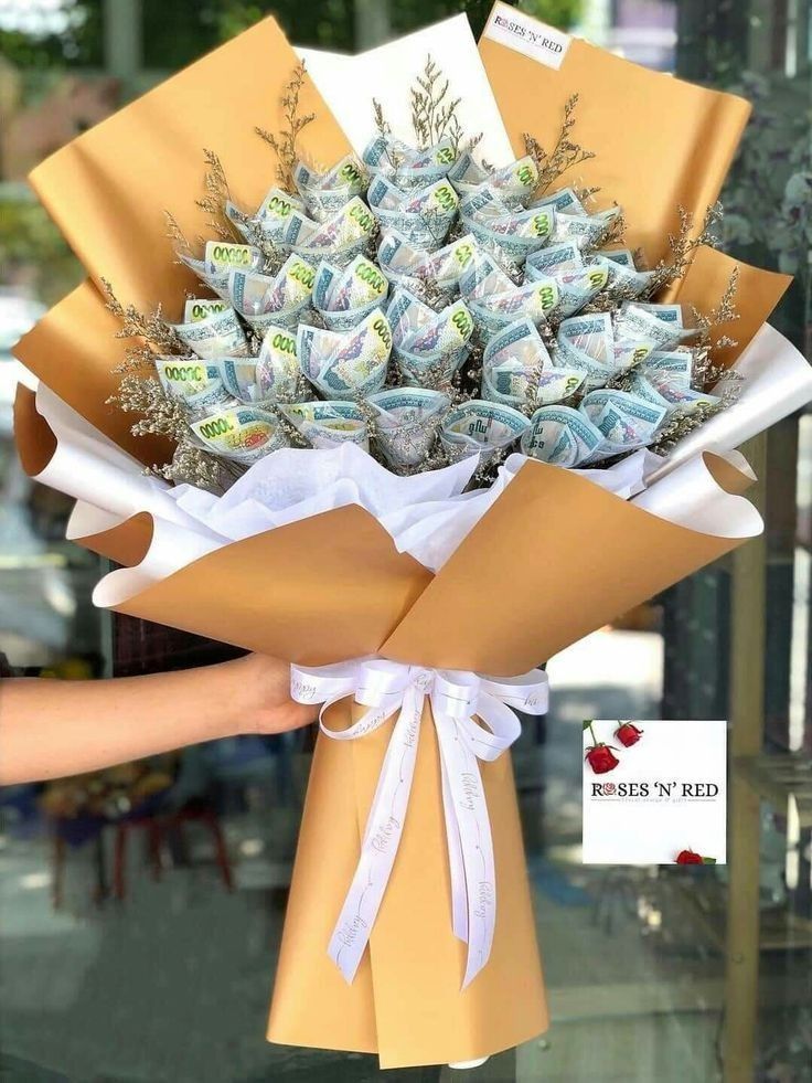 a bouquet of money wrapped in brown paper