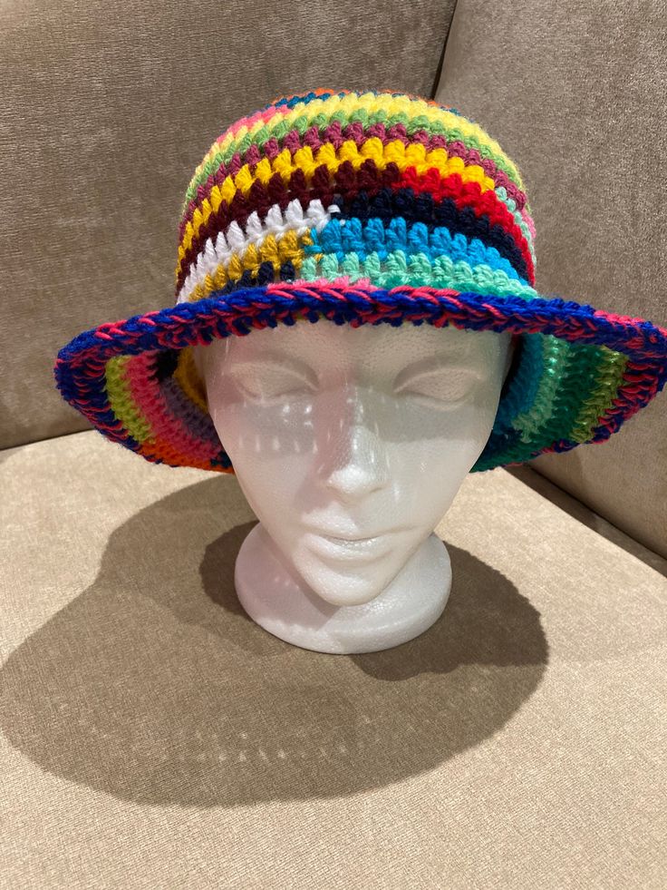 "Hand crocheted sun/bucket hat 100% acrylic Size: 20\"-22\" Typical head circumference sizes: 21\" Xsmall 22\" Xs/Small 23\" Small/Medium 24\" Medium/Large 25\" Large/XL All my hats are one of a kind, no two are the same  Foldable/travel Head Size in Inches Head Size in Centimeters American Hat Sizes   Head Size in Inches                          Head Size in Centimeters                            American Hat Sizes 19 3/8\"                                                 49.2 cm Casual Acrylic Hats For The Beach, Casual Adjustable Crochet Hat, Acrylic Beanie For The Beach, Adjustable Yarn Bucket Hat For Winter, Casual Brimmed Hat Made Of Acrylic Yarn, Casual Brimmed Hat In Acrylic Yarn, Casual Brimmed Crochet Hat In Acrylic, Casual Brimmed Acrylic Crochet Hat, Adjustable Acrylic Yarn Bucket Hat