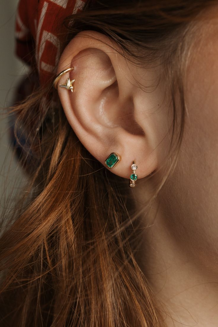 DETAILS Metal - 14k yellow gold Stone(s) - 0.13tcw sapphires with 0.08tcw diamonds 0.09tcw emeralds with 0.08tcw diamonds 11mm huggie hoop earrings WHY WE LOVE IT Sure to be a new LPJ staple! These dainty huggie hoops have alternating bezel set diamonds and gemstones lining the outer hoop - available in classic blue sapphire or green emerald. The perfect pop of color to add to your ear party. SHIPPING + RETURNS Learn about our Return + Exchange Policy here. LET'S CHAT! Don't see your size? Curio Ear Party, Let's Chat, Bezel Set Diamond, Gold Stone, Earring Sale, Huggie Hoop Earrings, Green Emerald, Jewelry Case, Custom Engagement Ring