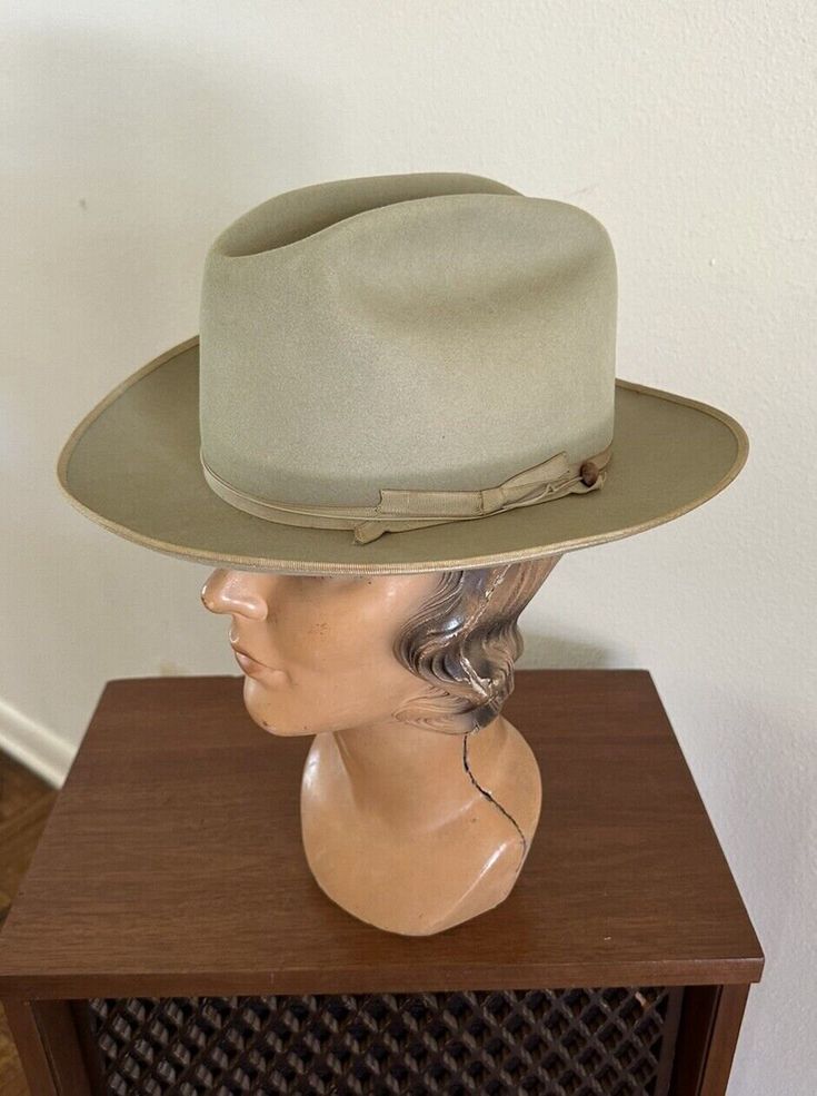 For your consideration Original vintage 1960s era Stetson 3x Beaver Silverbelly Open Road cowboy western hat Grosgrain headband Brown leather sweatband Wind Cord Marked size 7 Inventory tag .. original price $10.95 Color: Silverbelly Made in USA Great hat in pre-owned condition .. shows age / patina'd soiling spot on inner liner .. maybe faint spoiling from age and wear and handling on crown and brim .. moth nips .. the sweatband is supple Shown on vintage size small lady mannequin head .. NFS 2 Vintage Fitted Hat Bands For Rodeo, Vintage Fitted Felt Hat For Ranch, Vintage Fitted Hat For Ranch, Fitted Vintage Hat For Ranch, Vintage Top Hat With Flat Brim For Ranch, Vintage Brown Fedora With High Crown, Vintage High Crown Brown Fedora, Vintage Fitted Fedora For Ranch, Vintage Flat Brim Top Hat For Ranch