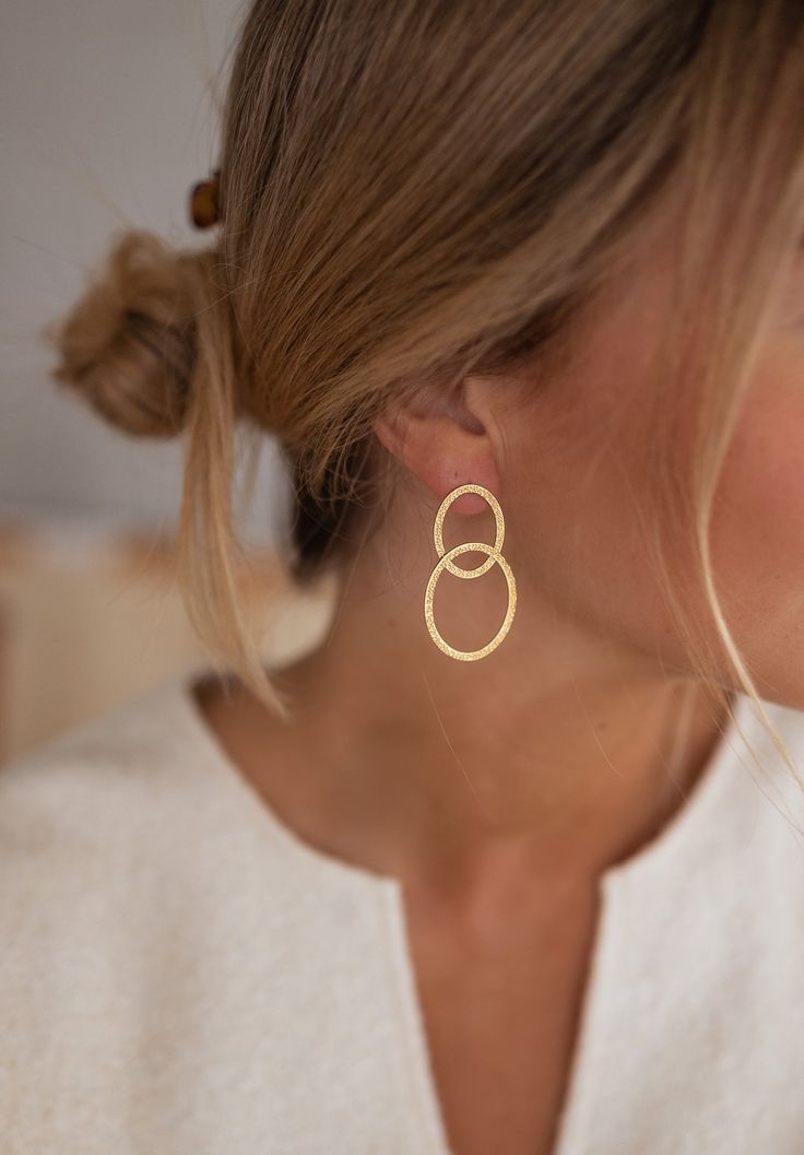 Stylish and durable earrings made of high-quality stainless steel with a stunning golden finish. Perfect touch of elegance to any outfit. Gold Hypoallergenic Metal Earrings, Hypoallergenic Matte Gold Metal Jewelry, Yellow Gold Stainless Steel Earrings For Gift, Tarnish Resistant Rose Gold Stainless Steel Earrings, Minimalist Yellow Gold Plated Earrings, Matte Gold Hypoallergenic Metal Jewelry, Gold Stainless Steel Pierced Earrings, Hypoallergenic Gold-tone Gold-plated Earrings, Modern Round Gold Plated Earrings