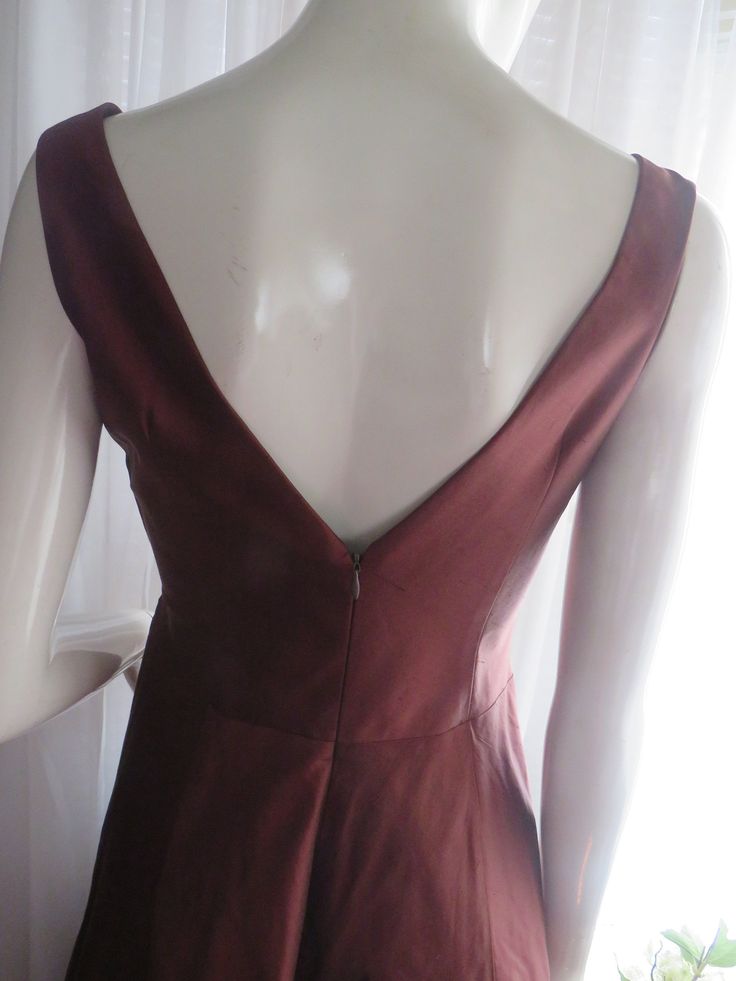 "1990's sleeveless, deep-V front/back bronze/dark brown cocktail dress, by Nicole Miller of New York, in a size 6. Dress has a big flared circle skirt, with attached under slip of silk/netting, back nylon zipper, outer dress fabric is silk. Front bodice is in a deep-V cleavage in a large bust bow look, as well as a deep-V bodice back. Dress is in great condition, Bust 32 1/2\", Waist 28\". PRICE IS $179.00------SALE FINAL/AS IS/NO RETURNS." Sleeveless Brown Evening Dress, Brown Sleeveless Evening Dress, Formal Brown Lined Dress, Elegant Brown Lined Dress For Evening, Elegant Brown Lined Evening Dress, Brown Cocktail Dress, Brown Cocktail, Brown Flares, Outer Dress