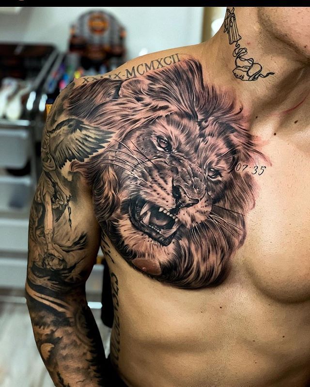 a man with a lion tattoo on his chest