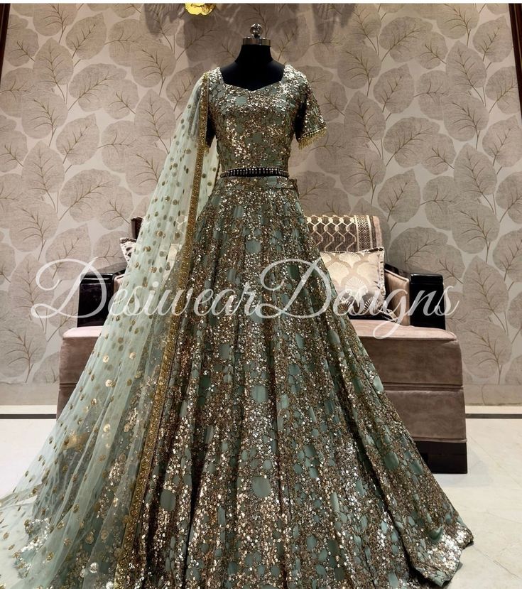 Made to Order/Measurement/Custom Order Lehenga - Color : sage green - Fabric : Embroidered georgette - Fully flared paneled lehenga - Embroidered  Blouse -  Net Dupatta with Gold Border - Drawstring closure with Tassels - - It can be customize in any design or size  PLEASE NOTE: BUYERS ARE RESPONSIBLE FOR ANY CUSTOMS AND IMPORT TAXES THAT MAY APPLY. This is a made to order product. If you opt for 'Made To Measurement Option', we will provide a measurement template and you can share the measurements likewise. If you want to opt for 'Standard Size', Please refer to the size chart provided in the listing. Shipping: Standard Shipping is done by DHL ecommerce and it mostly takes 2 to 3 weeks to deliver after dispatch. Express Shipping is done by DHL express and it mostly delivers within a week Sequin Anarkali Set For Wedding Party, Sequined Salwar Kameez For Wedding Party, Traditional Wedding Wear With Sequins, Traditional Sequined Wedding Wear, Anarkali Salwar Kameez With Sequins For Wedding, Wedding Lehenga In Art Silk With Sequins, Heavy Kundan Lehenga For Reception, Bollywood Style Heavy Lehenga For Festivals, Heavy Lehenga For Diwali