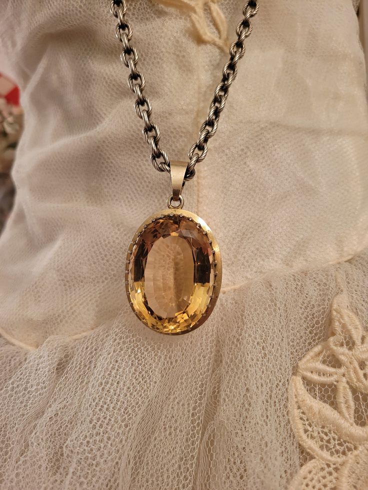 Rare beauty! This is the largest pendant I've ever seen. I am not sure of stone, probably a glass? Setting is old Claw style wit no markings, so it could  be a gold-filled, not sure. Very old and well made. It came from Europe. I've w9rn it on a heavy chain. It is heavy and large. Measures 2.5 inches long including bail and 1.5 inches wide. 1/2 inch thick. Really good condition, with minimal surface wear. It's a crazy cool piece if you collect antique jewelry.  Chain is not included. Other hearts/items not for sale. Antique Gemstone Jewelry For Memorial, Victorian Jewelry With Large Oval Pendant, Victorian Style Oval Jewelry With Large Pendant, Amber Pendant With Large Stone, Oval Citrine Amber Necklace, Oval Amber Citrine Necklace, Yellow Gold Citrine Oval Pendant Jewelry, Victorian Oval Large Pendant Jewelry, Yellow Gold Pendant Jewelry With Large Stone