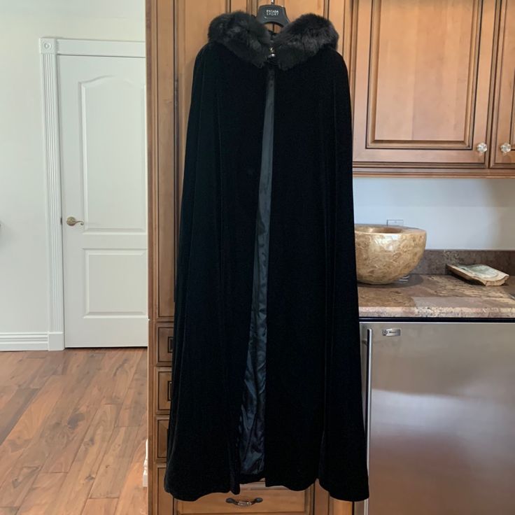 Escada Black Velvet Long Cape With Bluefox Fur Hooded Collar Size Large. Stunning Classy Statement Piece Winter Costume Cape Outerwear, Winter Costume Cape, Black Outerwear For Costume, Black Costume Outerwear, Winter Costume Outerwear With Faux Fur Lining, Luxury Long Sleeve Costume Outerwear, Black Hooded Fur Coat With Detachable Hood, Velvet Cloak, Long Cape