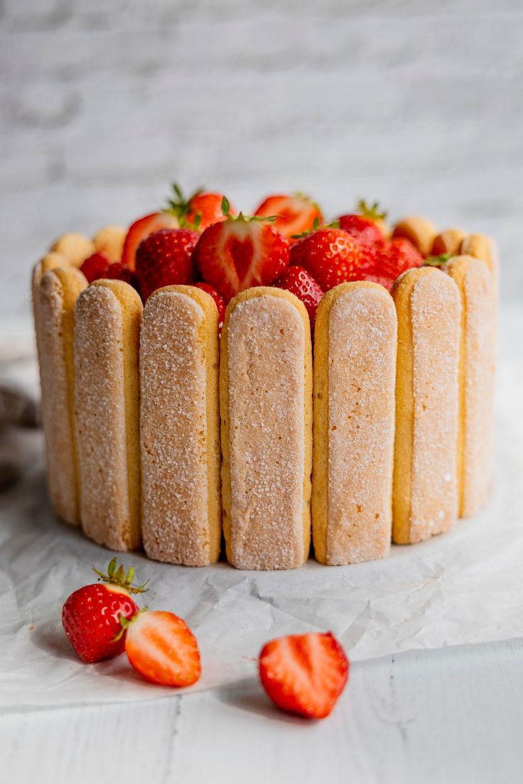 a cake that has some strawberries on it