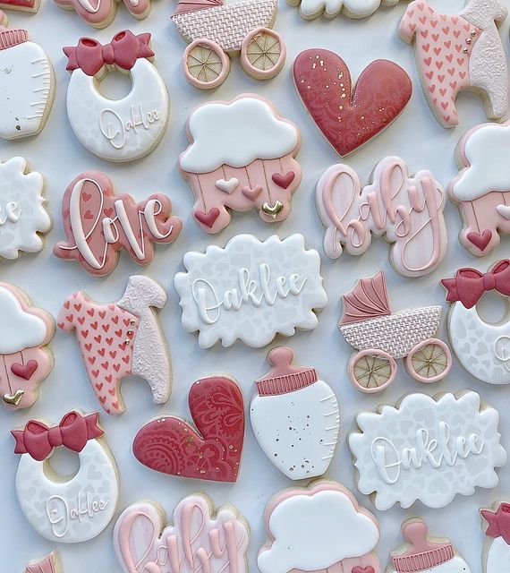 baby shower cookies decorated with pink and white icing