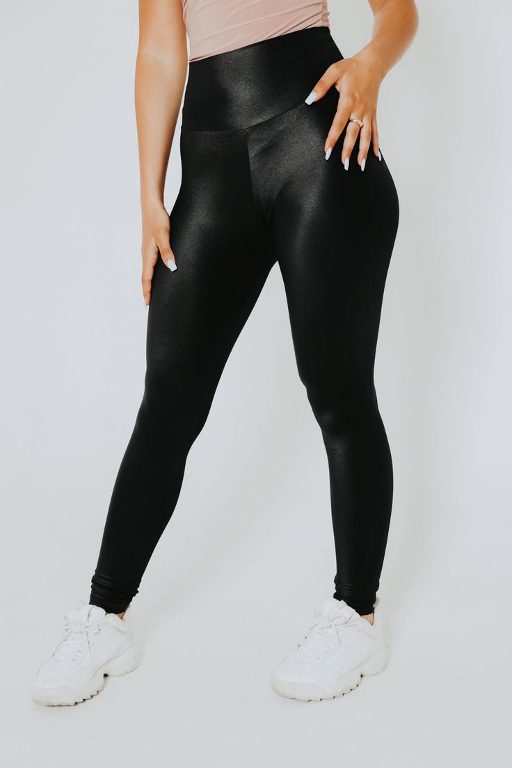 Joy Legging - where style meets comfort and versatility. These stunning, shiny black statement leggings feature an ultra-comfortable, high-rise waistband that not only flatters your figure but also provides the ideal canvas for various outfit pairings. ✨ Tummy Control: The high-waisted design sculpts and smoothes your midsection for a flattering silhouette that boosts your confidence. And the high-rise waistband is a boon on bloating days, giving you a slimmer and more comfortable look. ✨ Versat