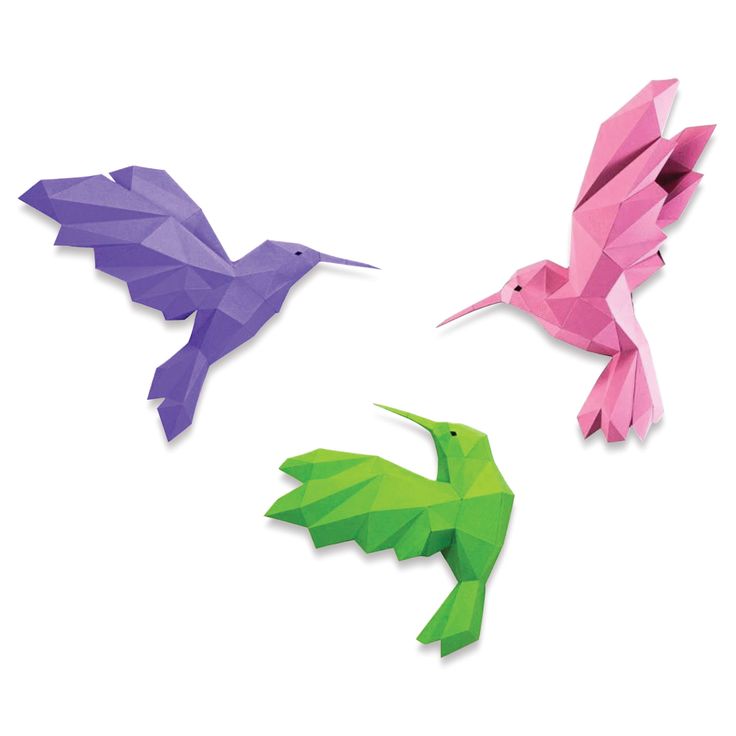 three different colored origami birds sitting on top of a white surface with one bird flying towards the other