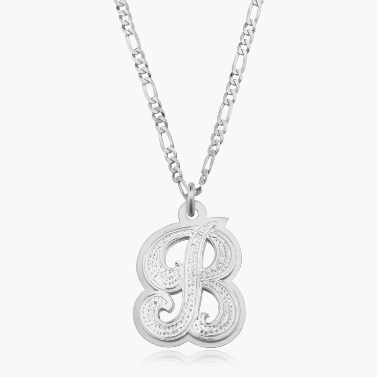 Our popular Double Plated Iced Out Initial Necklace boasts a chic and elegant design, handcrafted to perfection. The model showcases the necklace with an 18-inch Figaro chain (see video for reference). You can personalize this item with Letters, Numbers, and Roman Numerals and choose from chain lengths of 14", 16", 18", and 20". Each chain features a lobster clasp closure for secure wear.Chain width:Cuban Chain - 3.7 mmFigaro Chain - 3 mm Classic Initial Pendant Necklace, Classic White Gold Initial Necklace, Classic Initial Pendant Chain Necklace, Elegant Silver Initial Pendant Custom Necklace, Elegant Silver Initial Pendant Necklace, Elegant Silver Custom Necklace With Initial Pendant, Anniversary Silver Name Necklace With Figaro Chain, Classic Silver Initial Necklace For Formal Occasions, Luxury Hallmarked Initial Pendant Necklace