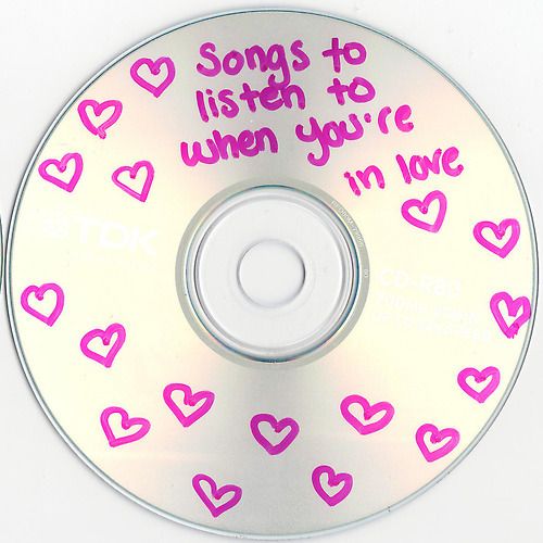 a cd with pink hearts and words on the disc cover that says, songs to listen to when you're i'm love