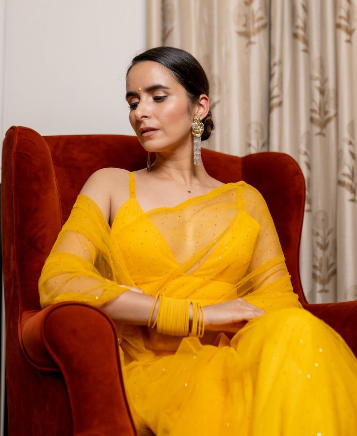 Mukesh Work On Organza SareeFeaturing a yellow pre-stitched saree in organza base. It is paired with a matching strappy v-neck blouse. Delivery time 15 to 20 days Yellow Organza Pre-draped Saree For Party, Yellow Bollywood Pre-draped Saree, Semi-stitched Yellow Saree With Sheer Dupatta, Yellow Anarkali Style Pre-draped Organza Saree, Yellow Georgette Dupatta For Party, Designer Yellow Saree With Sheer Dupatta, Bollywood Style Yellow Pre-draped Saree With Unstitched Blouse, Yellow Bollywood Pre-draped Saree With Unstitched Blouse, Yellow Pre-draped Saree With Unstitched Blouse For Designer Wear