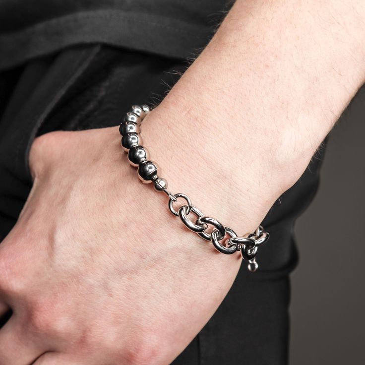 DESCRIPTION:This Mitte silver steel bead and chain adjustable signature bracelet provides a sophisticated and contemporary style. Crafted with premium stainless steel chain and hand strung beads, this bracelet is waterproof and will not turn your skin green. Waterproof and tarnish resistant, this attractive bracelet is a modern and durable accessory.DETAILS: available in 6.5 and 7.5 with 1.5 inches tail chain stainless steel adjustable closure industrial modern FIT:Model has a 6.5 inch wrist and is wearing the 6.5 sizing Casual Silver Adjustable Chain Bracelet, Casual Silver Bracelets With Adjustable Chain, Casual Silver Bracelet With Adjustable Chain, Casual Silver Metal Chain Bracelet, Modern Metal Beaded Bracelets For Everyday Wear, Modern Metal Beaded Bracelets For Everyday, Silver Stainless Steel Jewelry With Beaded Chain, Elegant Stainless Steel Beaded Bracelets For Everyday, Modern Silver Beaded Bracelet As Gift