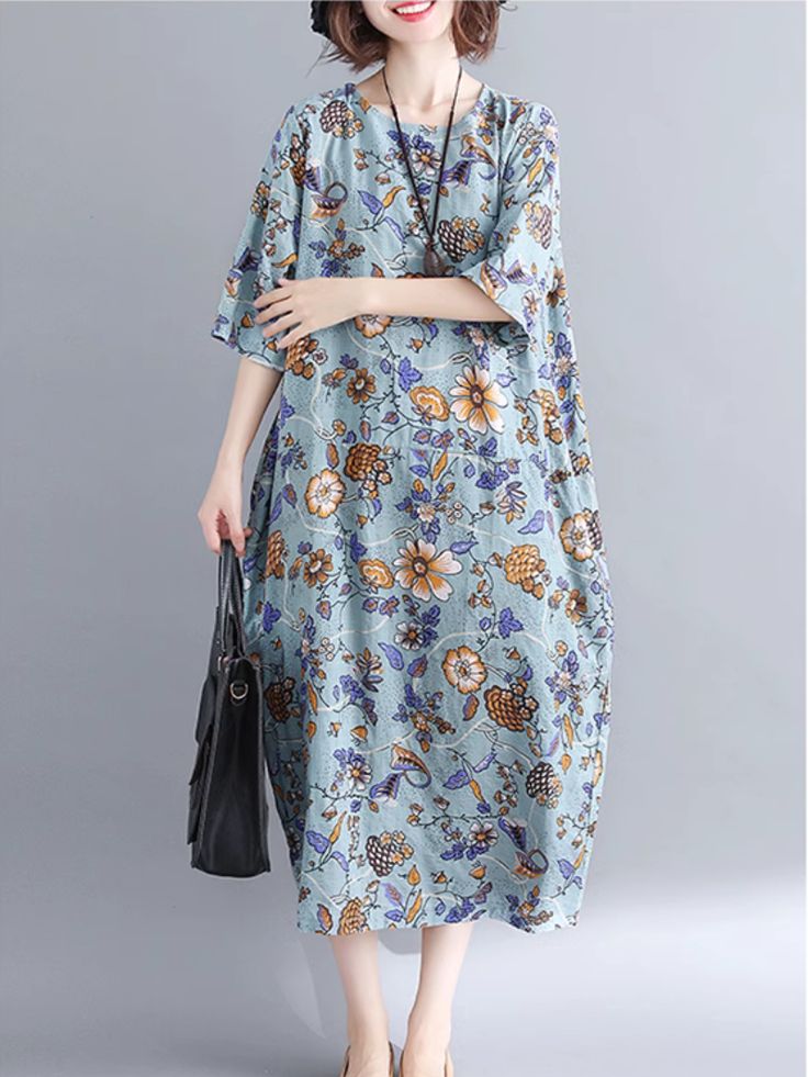 Elevate your wardrobe with our charming Women's Floral Mid-Length A-Line Dress. Crafted from comfortable cotton. its vibrant color pattern brings a touch of elegance to any occasion. The round neck collar and short sleeves create a timeless silhouette. while the practical addition of pockets enhances its functionality. Available in sizes L and XL. this dress offers a length of 120-121cm. a shoulder width of 41-42cm. and a bust measurement of 120-126cm. With sleeve lengths of 34cm (L) and 35cm (X Elegant Floral, Neck Collar, Xl Dress, Types Of Collars, Elegant Dresses, Mid Length, Color Patterns, A Line Dress, Round Neck