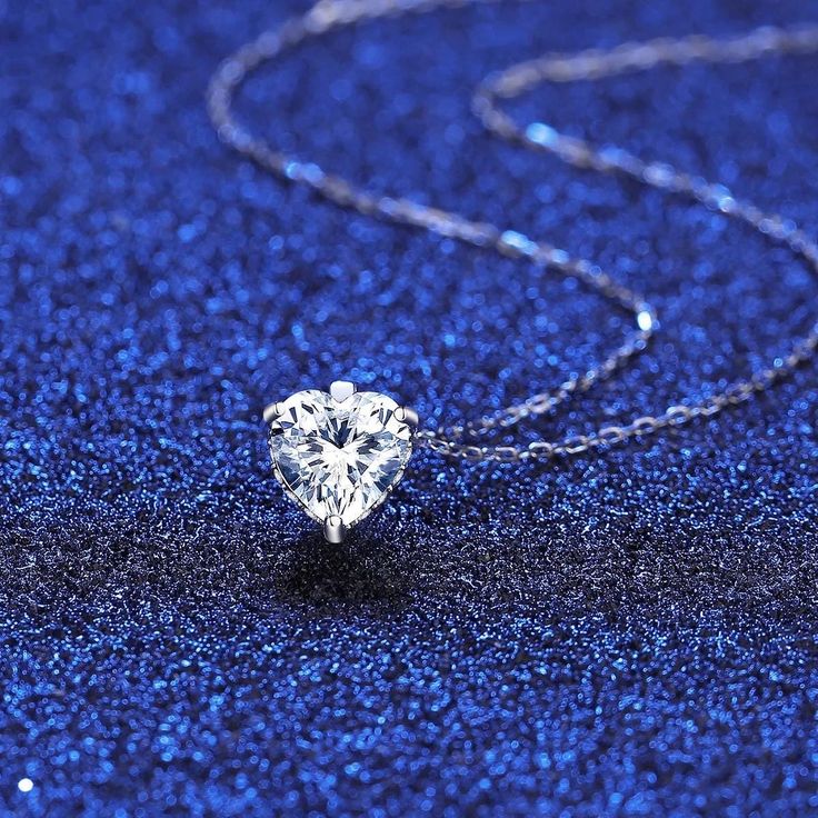 You are looking at gorgeous 1.2CT moissanite 925 sterling silver heart cut solitaire fashion necklace. The necklace features a 8.2mm/7.3mm (1 Carat) heart cut center stone, prong set in .925 sterling silver (stamped). Passes diamond tester. VVS1, Color d, Excellent cut. Comes with Moissanite Certificate. Gift Box included. Silver Cubic Zirconia Heart Necklace With Round Cut, Classic Silver Heart Necklace With Cubic Zirconia, Classic Silver Cubic Zirconia Heart Necklace, Silver Round Cut Heart Necklace Fine Jewelry, Cubic Zirconia Solitaire Necklace For Valentine's Anniversary, Sterling Silver Round Heart Necklace For Formal Events, Solitaire Necklace For Anniversary, Valentine's Day Round Cut, Silver Solitaire Necklace For Valentine's Day Wedding, Silver Heart Necklace In Sterling Silver, Round Cut